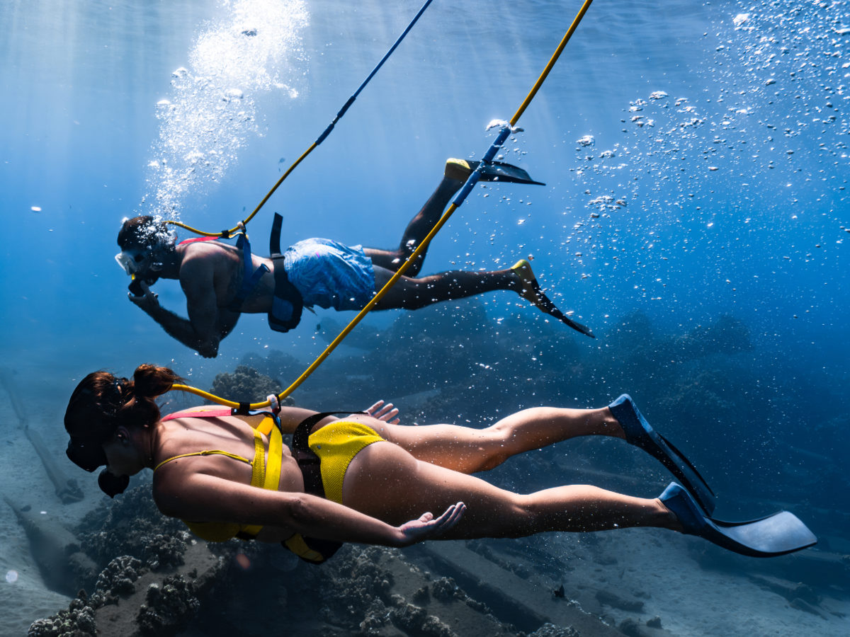 What is SNUBA? Two guests connected by hose to the floating raft above